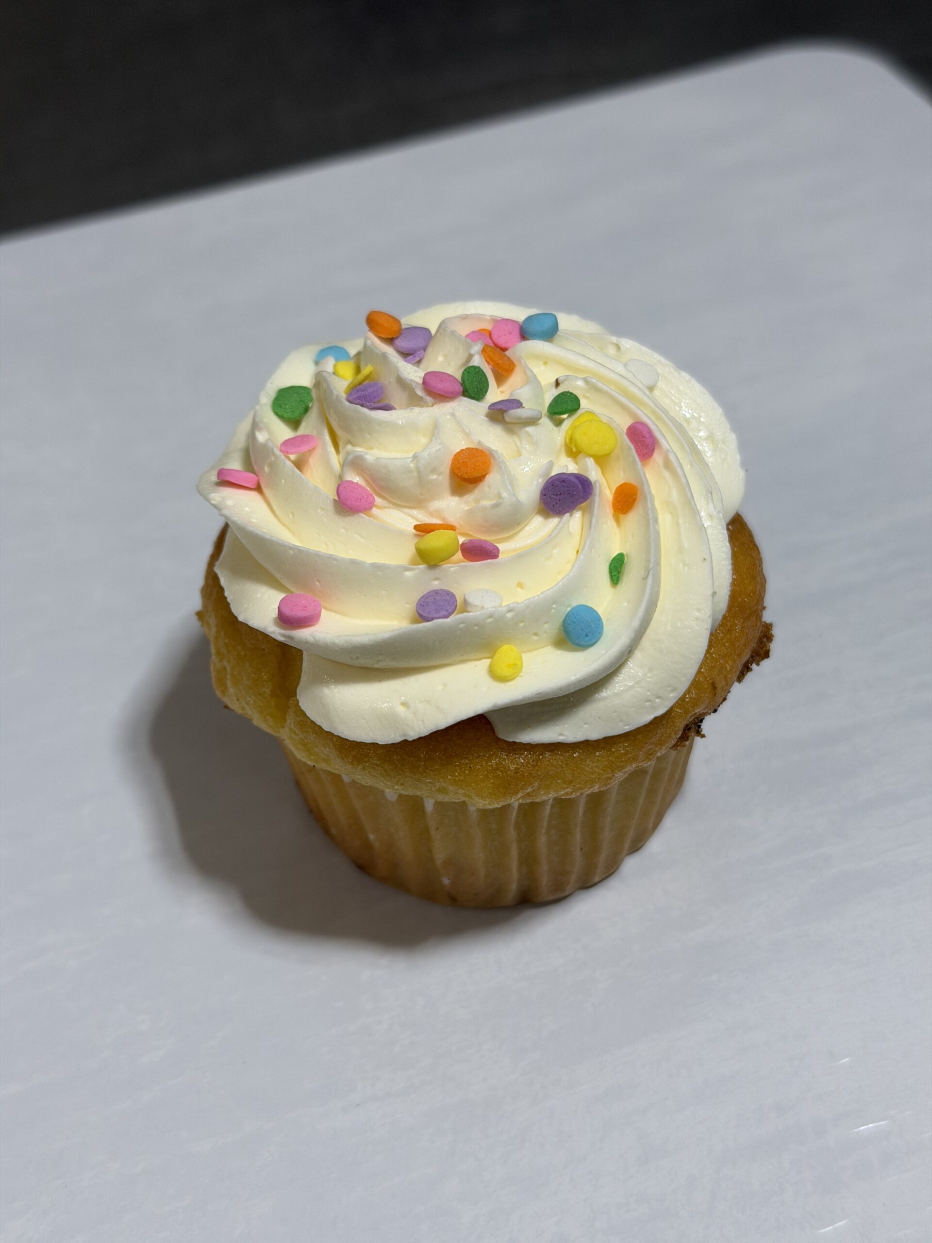 Vanilla Iced Cupcake With Sprinkles